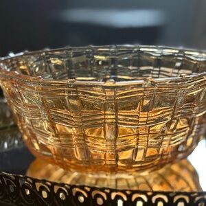 Vintage carnival glass bowl in the basket weave pattern and marigold iridescent
